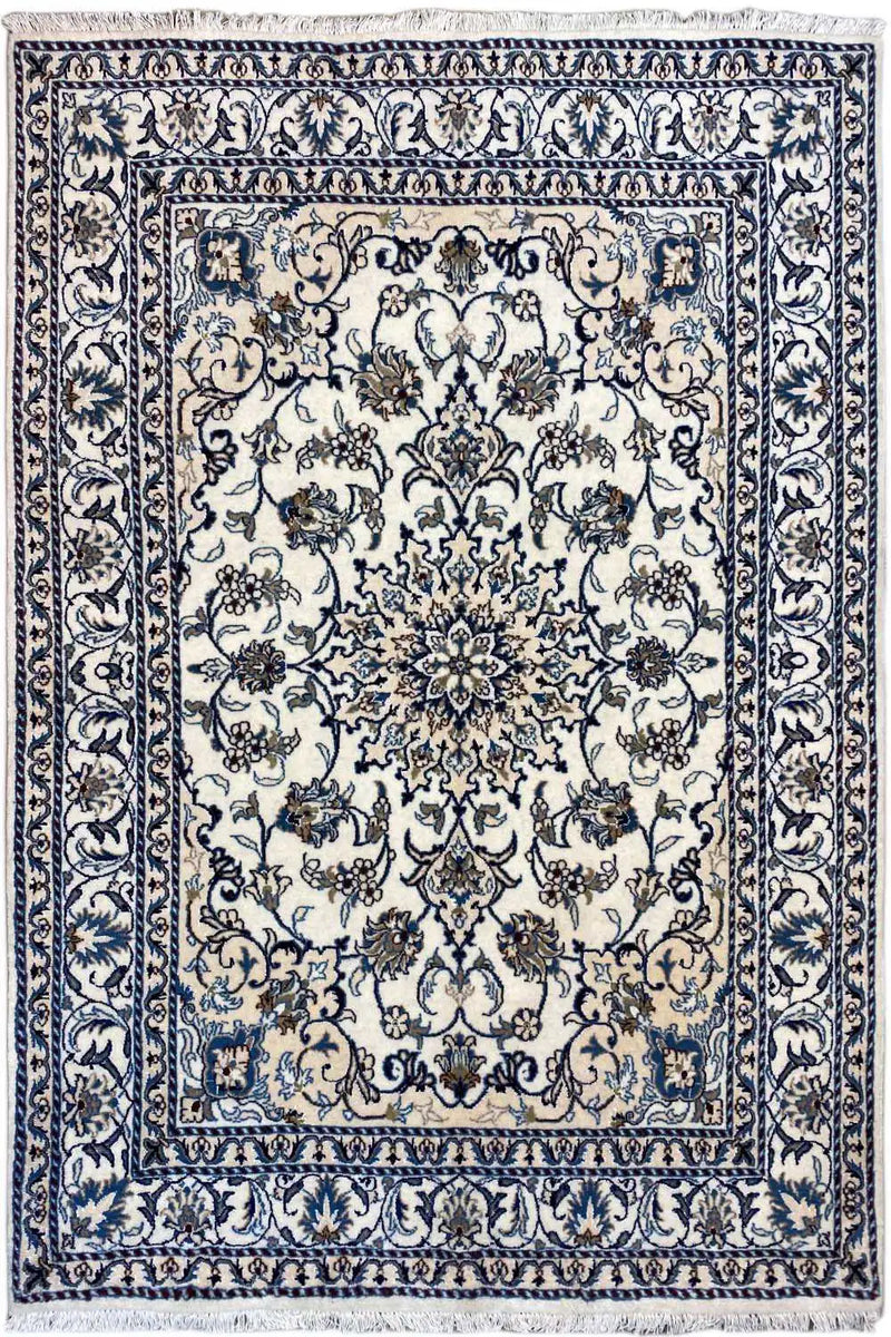 A beautiful nain teppich in beige color representing string of flowers in blue color. It has flower as a medallion in the center. 